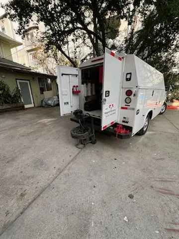 Magnet Plumbing service vehicle on-site for Grease Trap Cleaning in Summits Edge